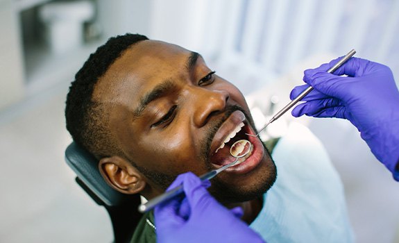 a man receiving a dental checkup